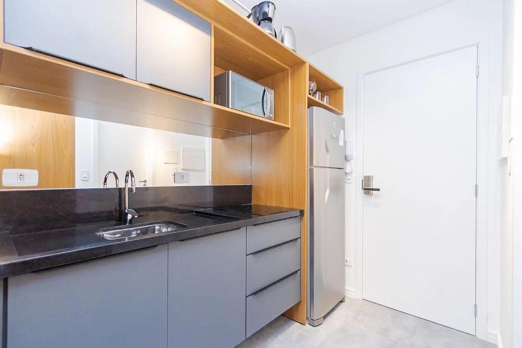Kuchyň nebo kuchyňský kout v ubytování Brickell One by Housi, prédio com academia próximo à rodoviária