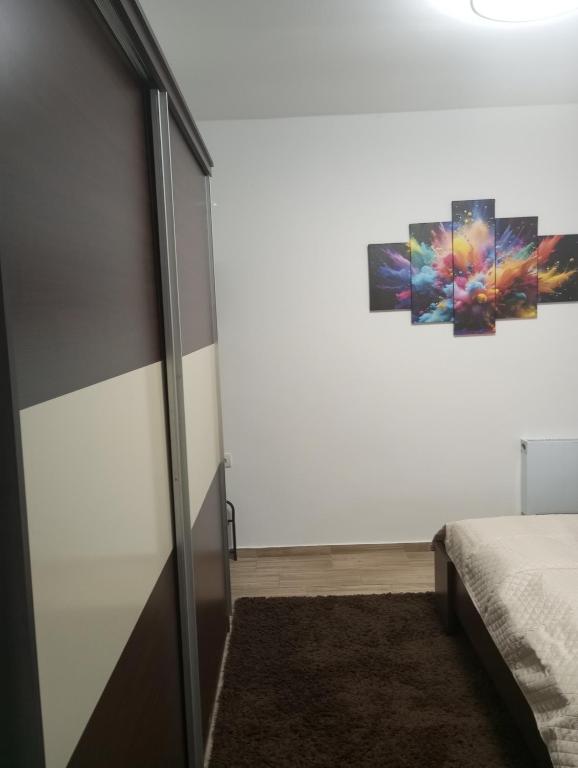 Postel nebo postele na pokoji v ubytování Dora Apartman