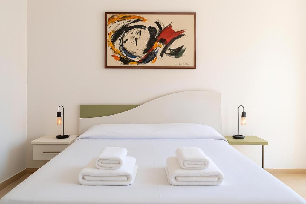 Ένα ή περισσότερα κρεβάτια σε δωμάτιο στο Casa Del Sole a 50 mt dal mare - Aria condizionata