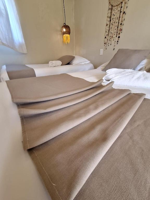 Postel nebo postele na pokoji v ubytování Nature Stay