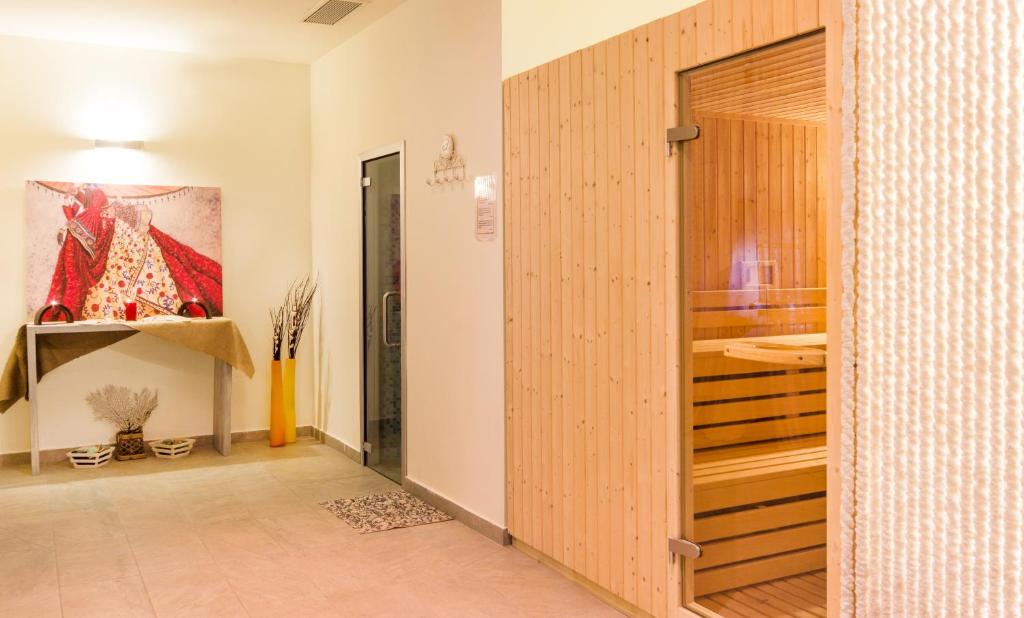 Postel nebo postele na pokoji v ubytování ALEA Hotel & Suites