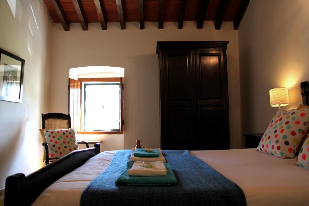 A bed or beds in a room at Quinta Dos Ribeiros