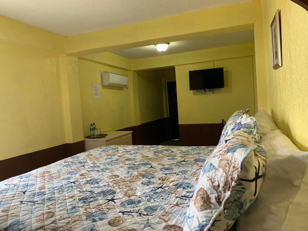 Postel nebo postele na pokoji v ubytování Bonefish Hotel