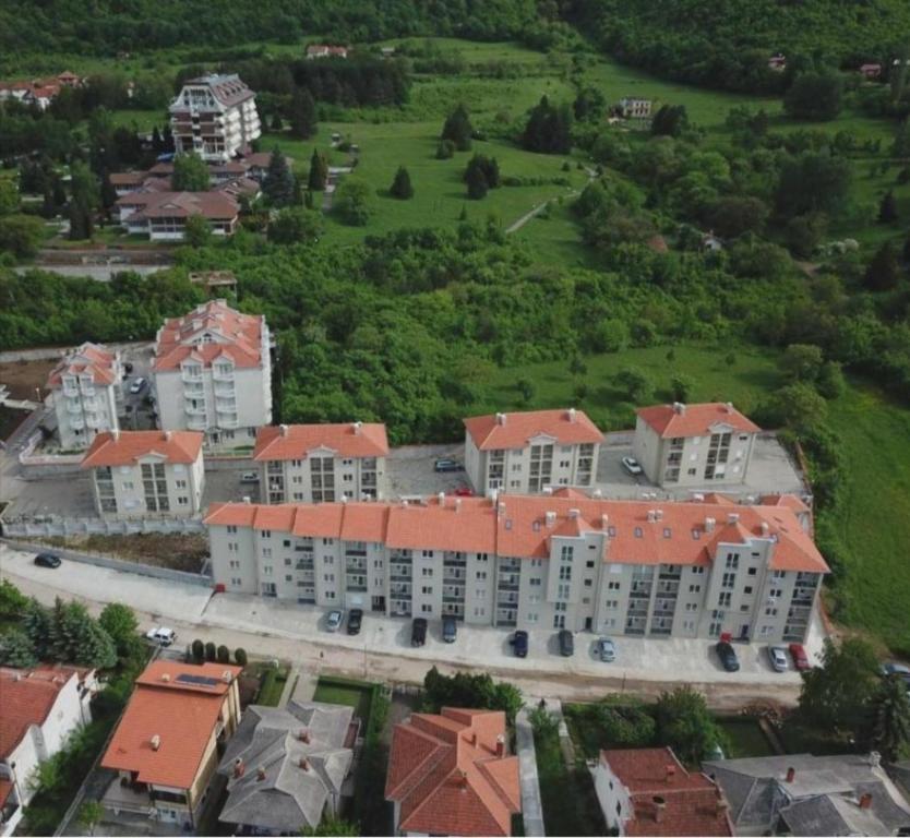 an aerial view of a large apartment complex with red roofs at Apartman Una in Soko Banja