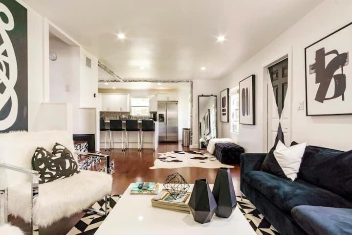 a living room with a couch and a table at 4BD 2BA - Black&White ArtBNB - Antique Row WPB in West Palm Beach