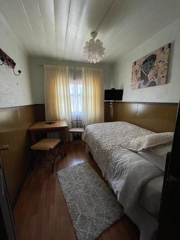 Postel nebo postele na pokoji v ubytování Hospedaje Colón
