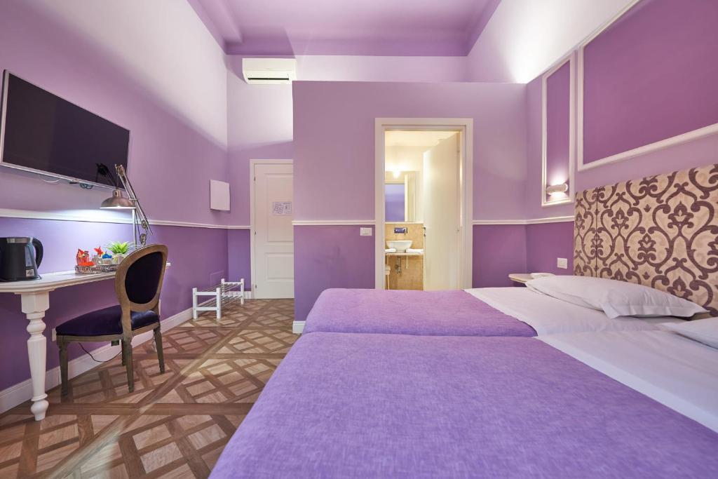 Letto o letti in una camera di B&B Le Stanze del Duomo