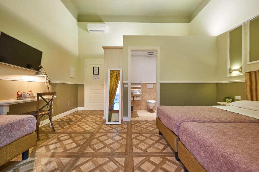 Letto o letti in una camera di B&B Le Stanze del Duomo