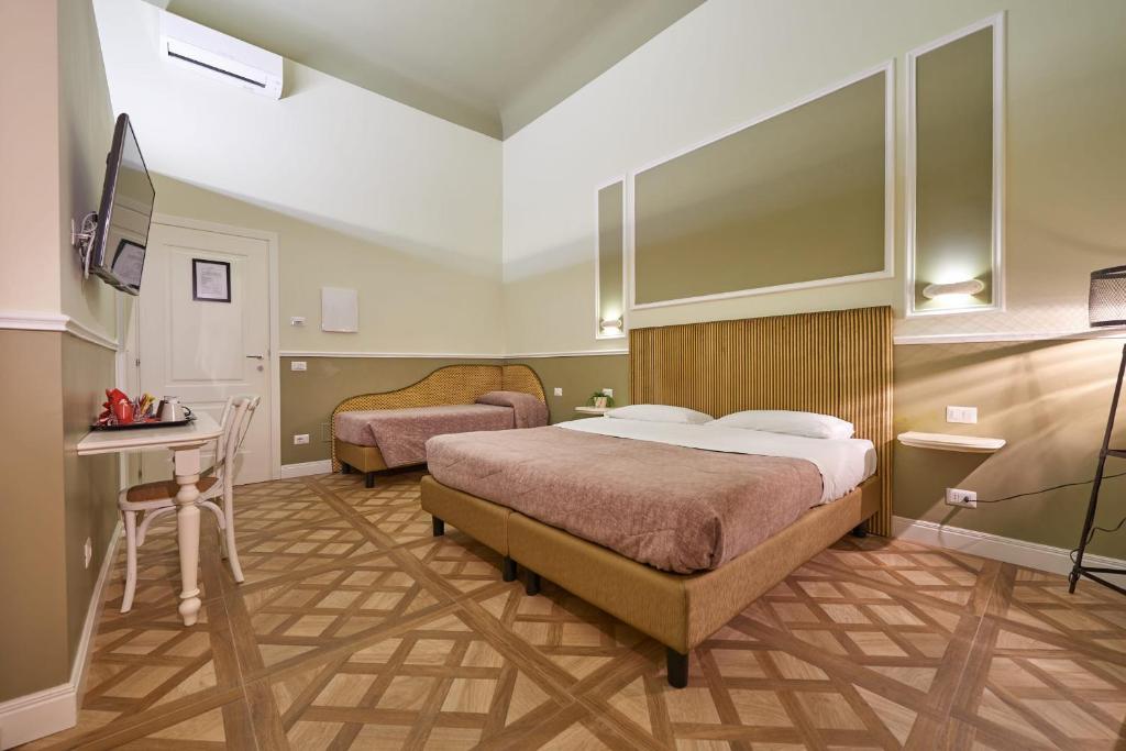 Letto o letti in una camera di B&B Le Stanze del Duomo