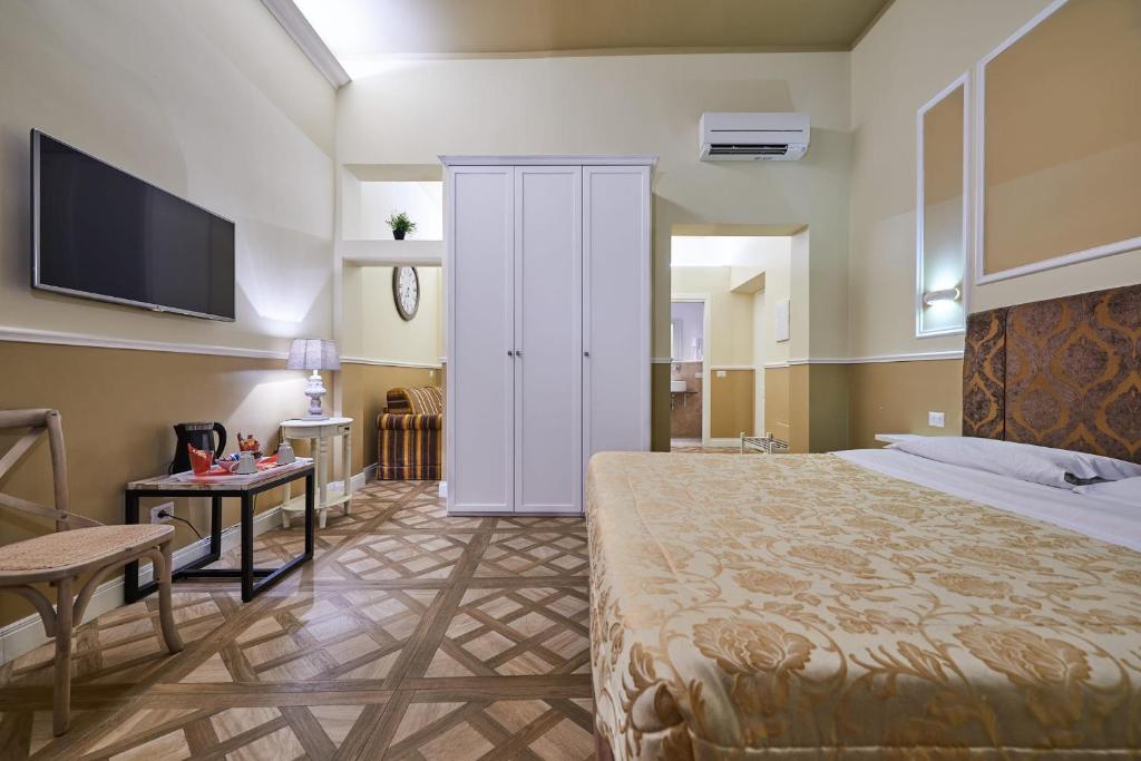 Letto o letti in una camera di B&B Le Stanze del Duomo