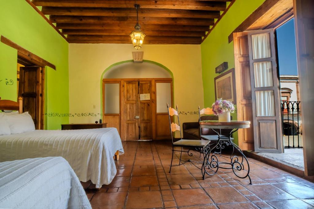Postel nebo postele na pokoji v ubytování Hotel Casa del Refugio