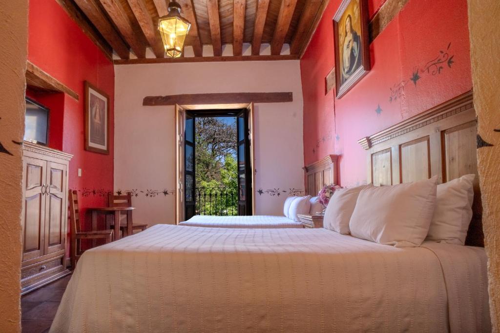 Postel nebo postele na pokoji v ubytování Hotel Casa del Refugio