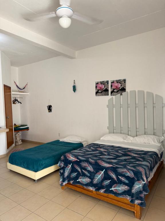 Postel nebo postele na pokoji v ubytování Terraza Tuxtla