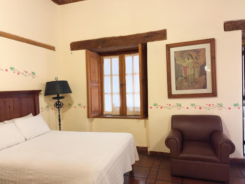 Postel nebo postele na pokoji v ubytování Hotel Casa del Refugio