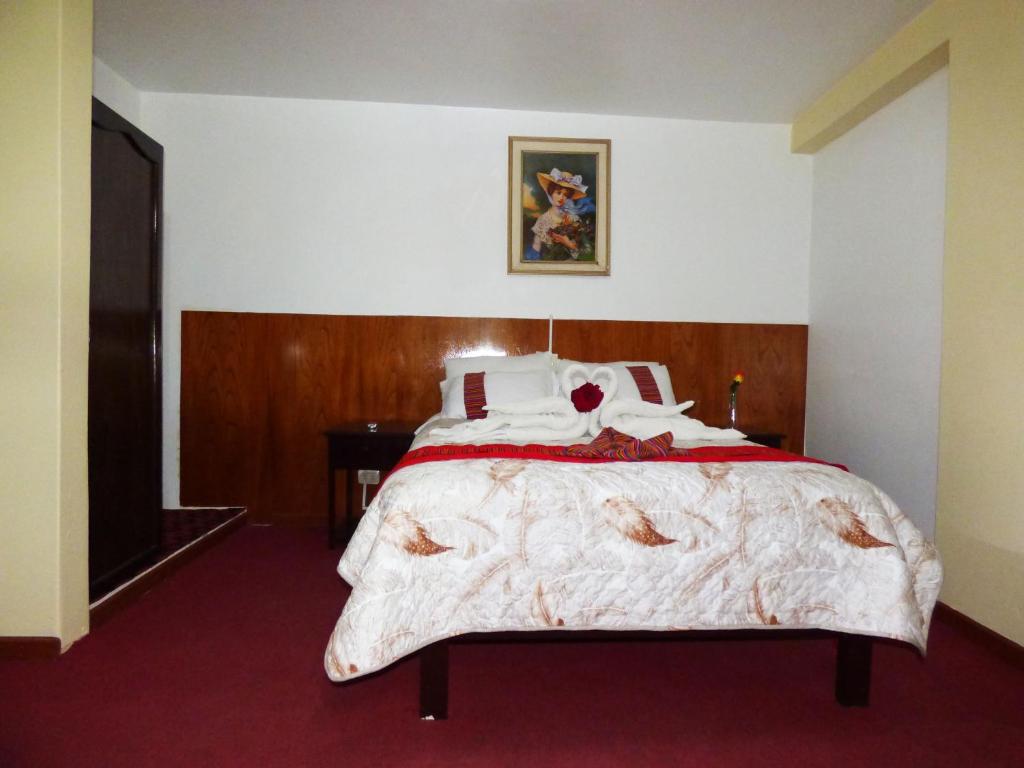 Postel nebo postele na pokoji v ubytování Nak Hoteles Plaza
