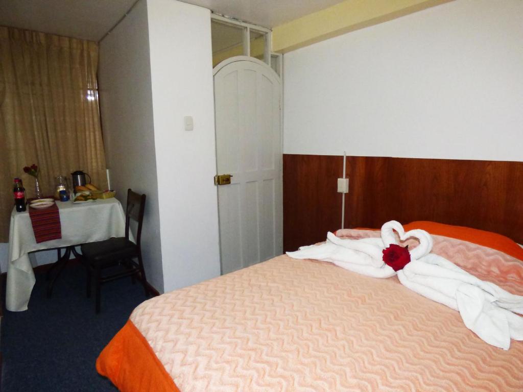 Postel nebo postele na pokoji v ubytování Nak Hoteles Plaza
