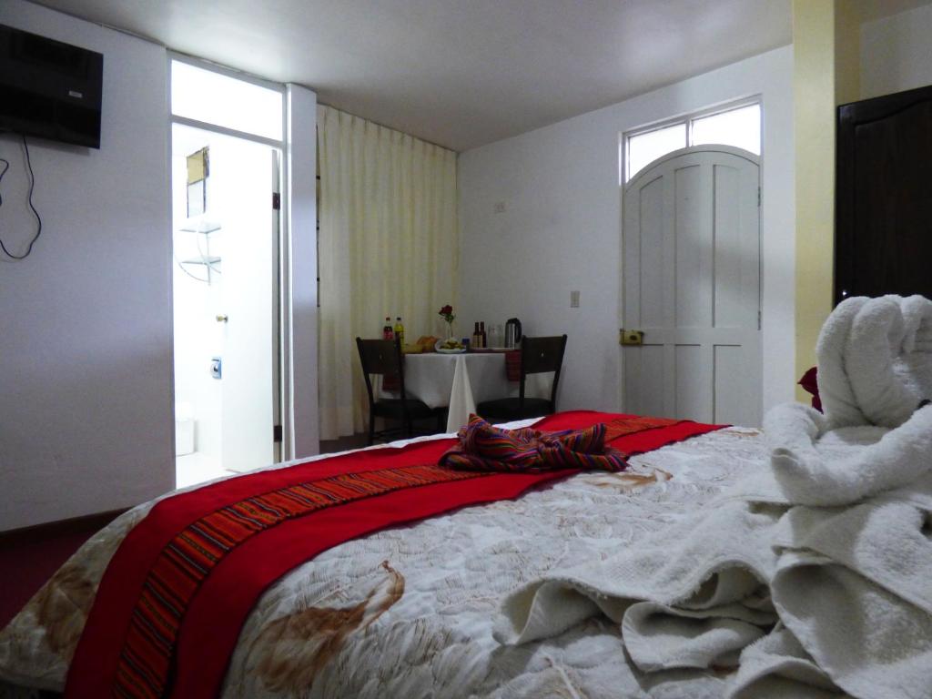 Postel nebo postele na pokoji v ubytování Nak Hoteles Plaza