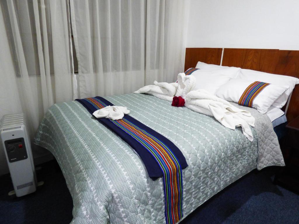 Postel nebo postele na pokoji v ubytování Nak Hoteles Plaza