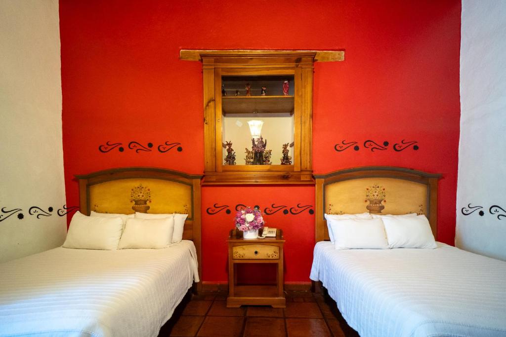 Postel nebo postele na pokoji v ubytování Hotel Casa del Refugio