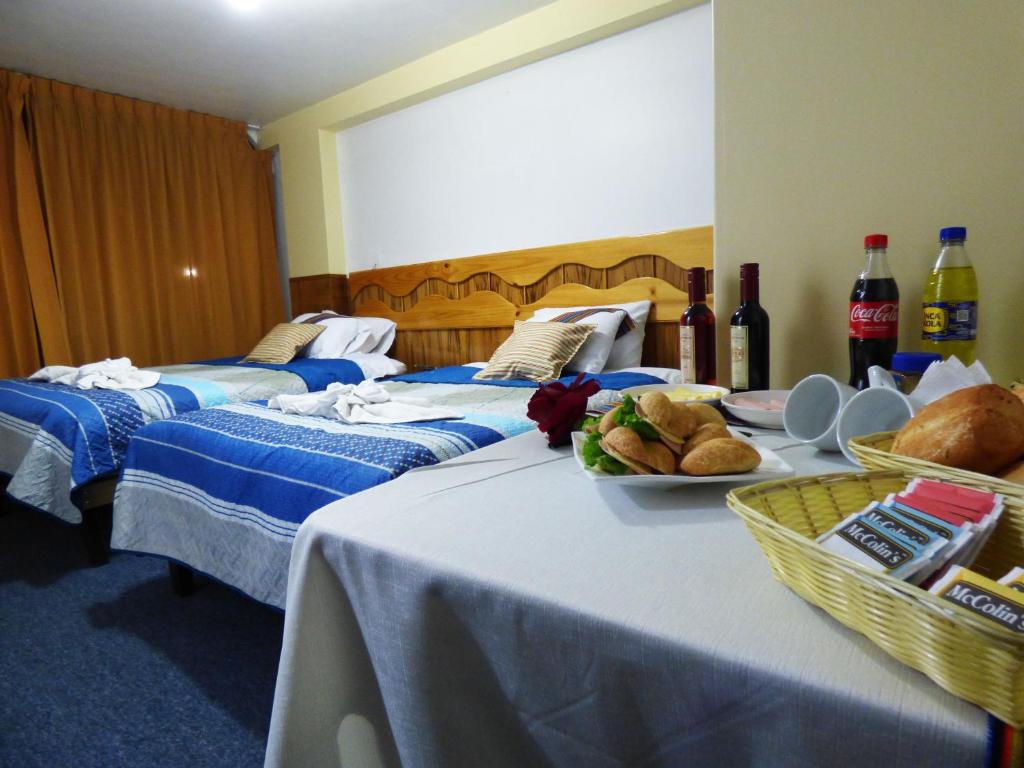 Postel nebo postele na pokoji v ubytování Nak Hoteles Plaza