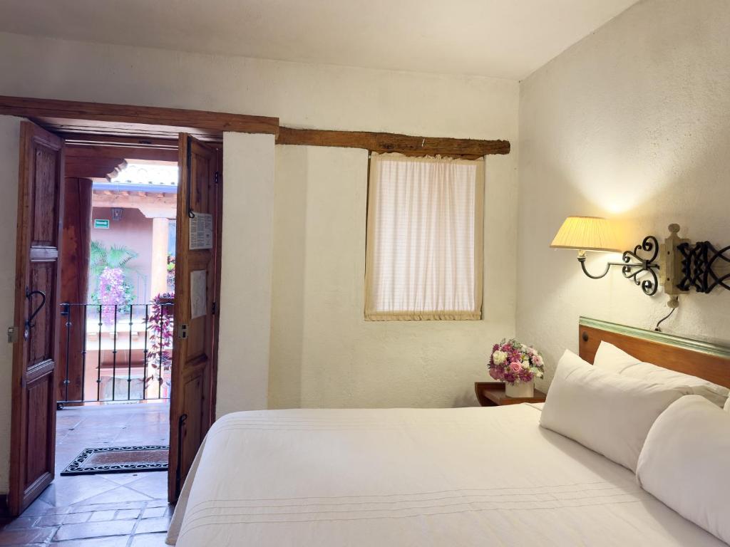Postel nebo postele na pokoji v ubytování Hotel Casa del Refugio