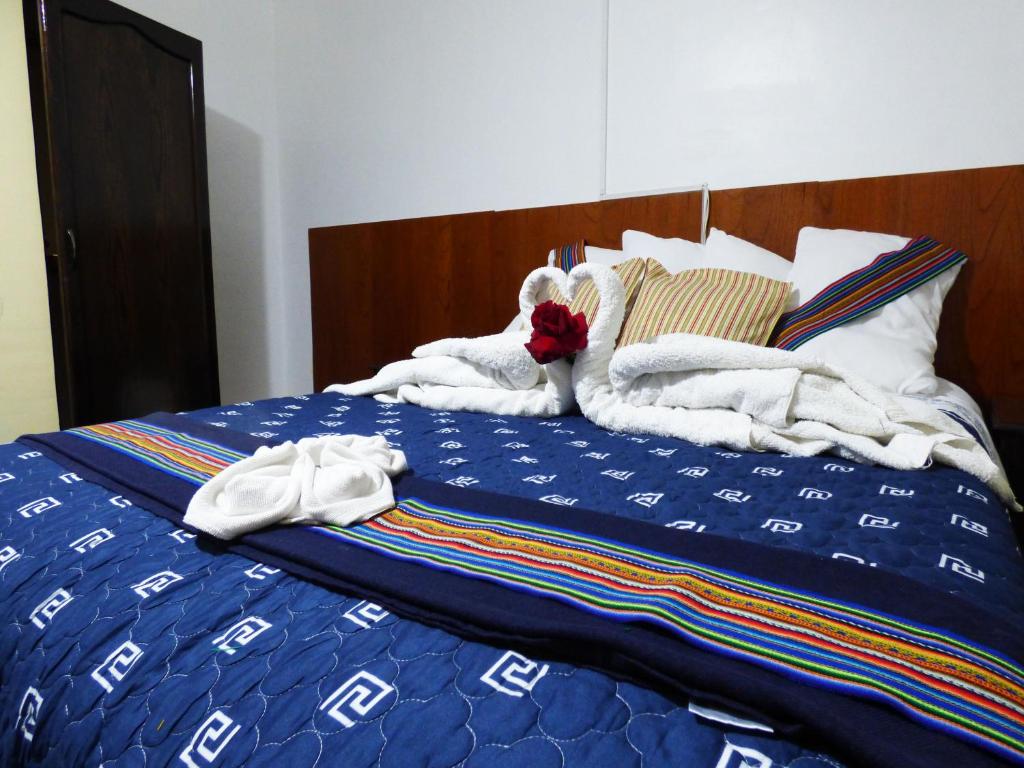 Postel nebo postele na pokoji v ubytování Nak Hoteles Plaza
