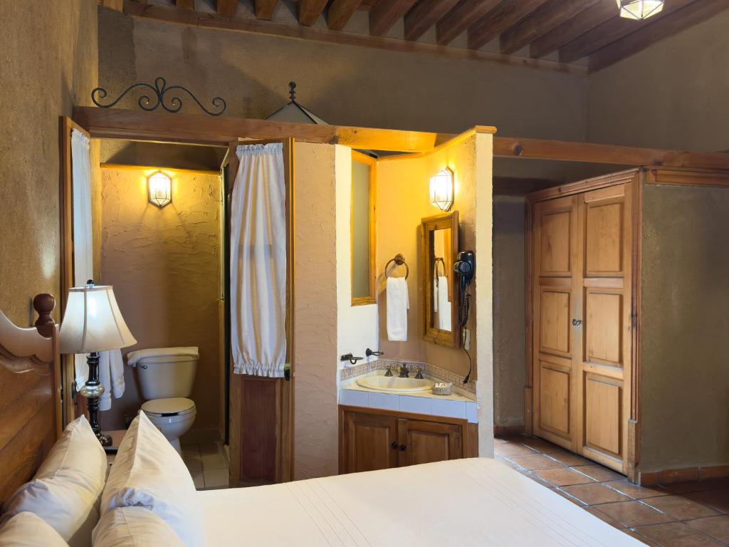 Postel nebo postele na pokoji v ubytování Hotel Casa del Refugio