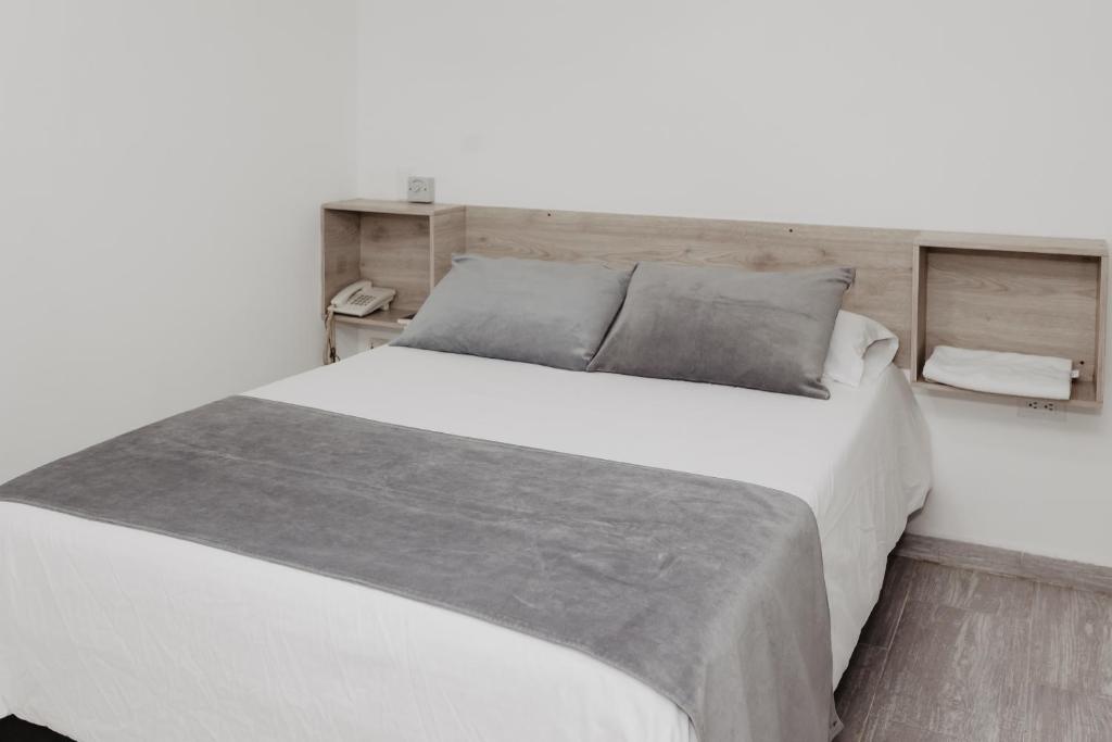 Postel nebo postele na pokoji v ubytování Hotel Plataneras Caney