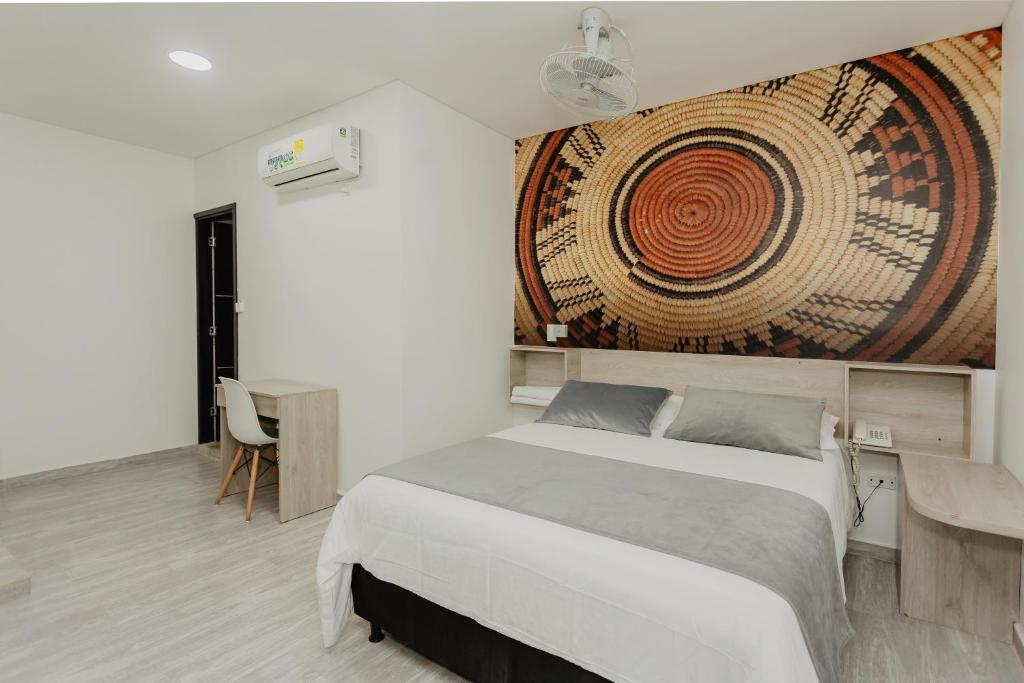 Postel nebo postele na pokoji v ubytování Hotel Plataneras Caney