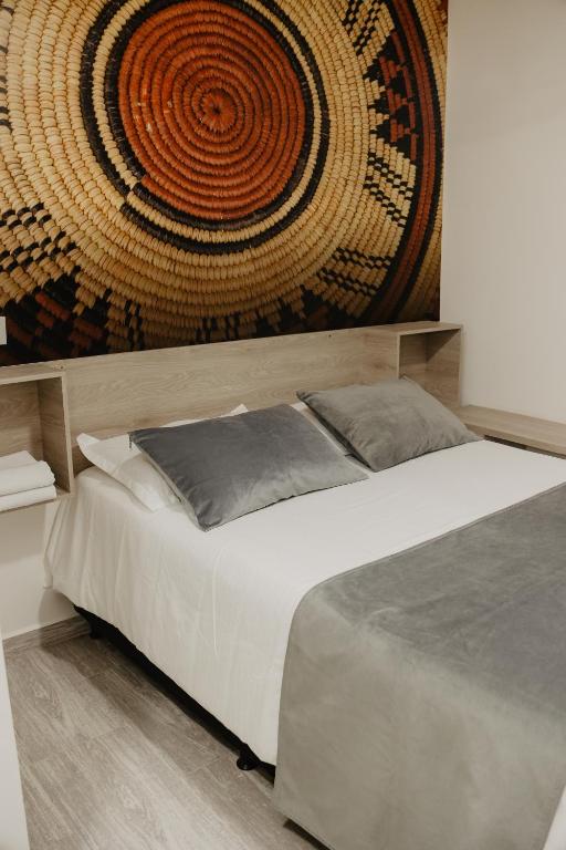 Postel nebo postele na pokoji v ubytování Hotel Plataneras Caney