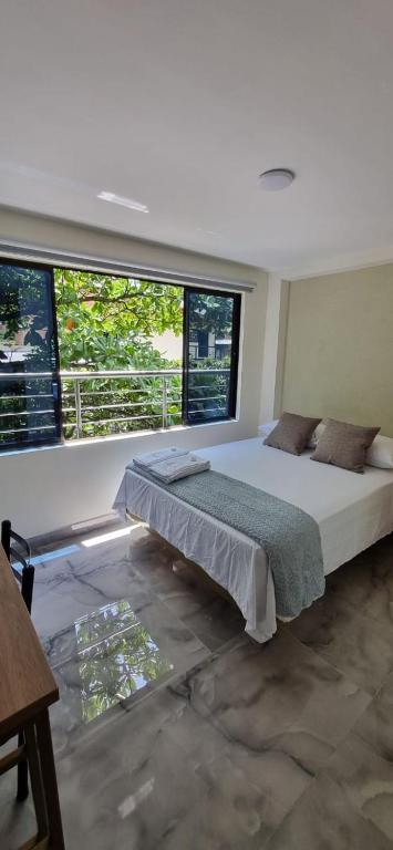 Postel nebo postele na pokoji v ubytování Hotel RUTA365