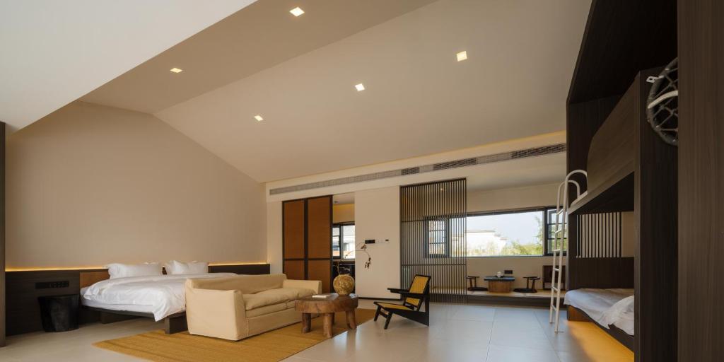 Postel nebo postele na pokoji v ubytování Huangshan Yixian Pumanmanju Hotel