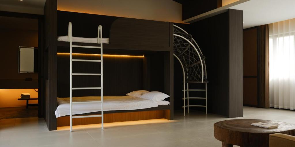 Postel nebo postele na pokoji v ubytování Huangshan Yixian Pumanmanju Hotel