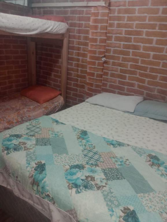 Postel nebo postele na pokoji v ubytování Suites com Wi-fi em Itajai