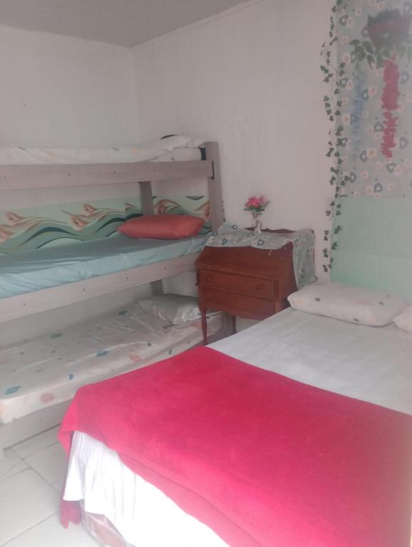 Postel nebo postele na pokoji v ubytování Suites com Wi-fi em Itajai