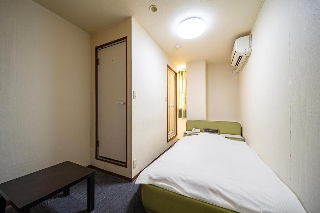 Postel nebo postele na pokoji v ubytování Hotel Xenia Takinoyashiro