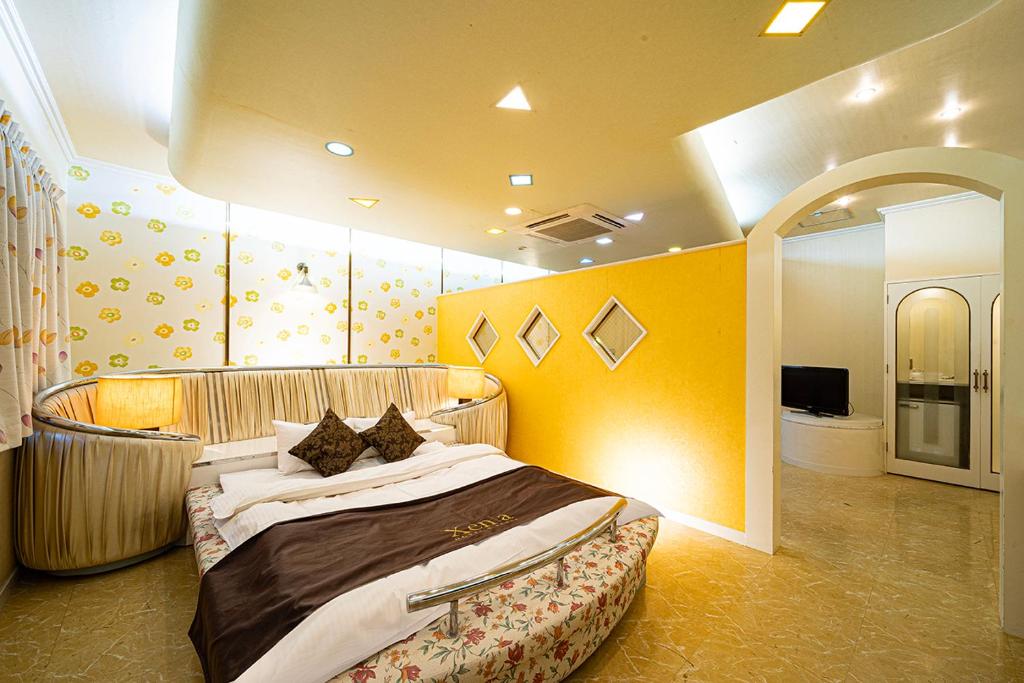 Postel nebo postele na pokoji v ubytování Hotel Xenia Takinoyashiro
