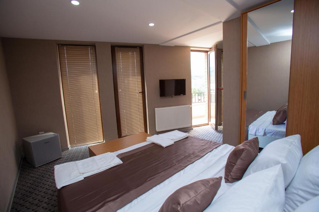 Postel nebo postele na pokoji v ubytování Hotel Voyager