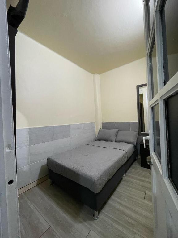 Postel nebo postele na pokoji v ubytování Hostel Quinta Camacho