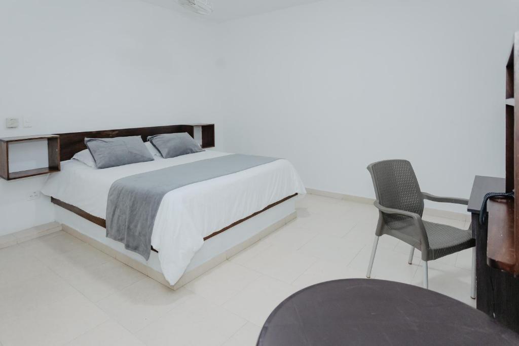 Postel nebo postele na pokoji v ubytování Hotel Plataneras Confort