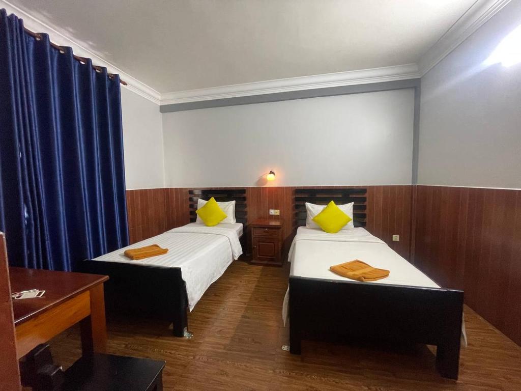 Postel nebo postele na pokoji v ubytování Jasmine Lodge Siem Reap