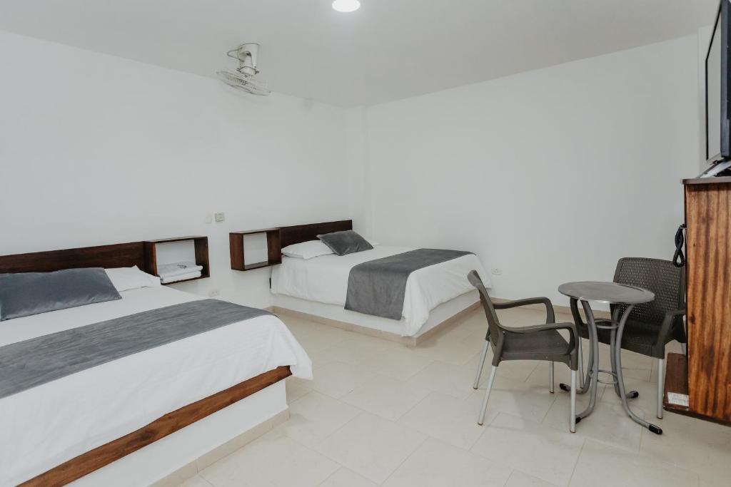 Postel nebo postele na pokoji v ubytování Hotel Plataneras Confort