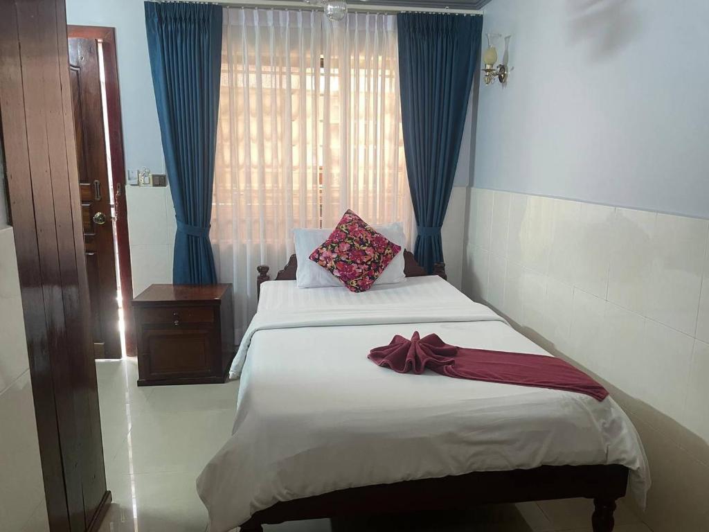 Postel nebo postele na pokoji v ubytování Jasmine Lodge Siem Reap
