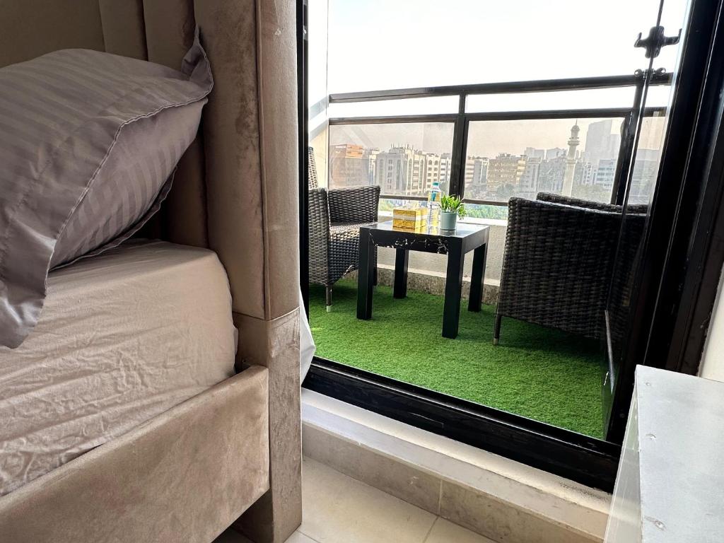 Ένα ή περισσότερα κρεβάτια σε δωμάτιο στο Abu Dhabi Phenomenal