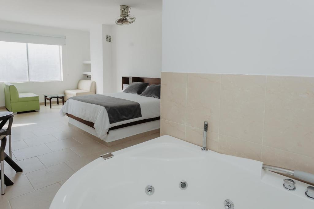 Postel nebo postele na pokoji v ubytování Hotel Plataneras Confort