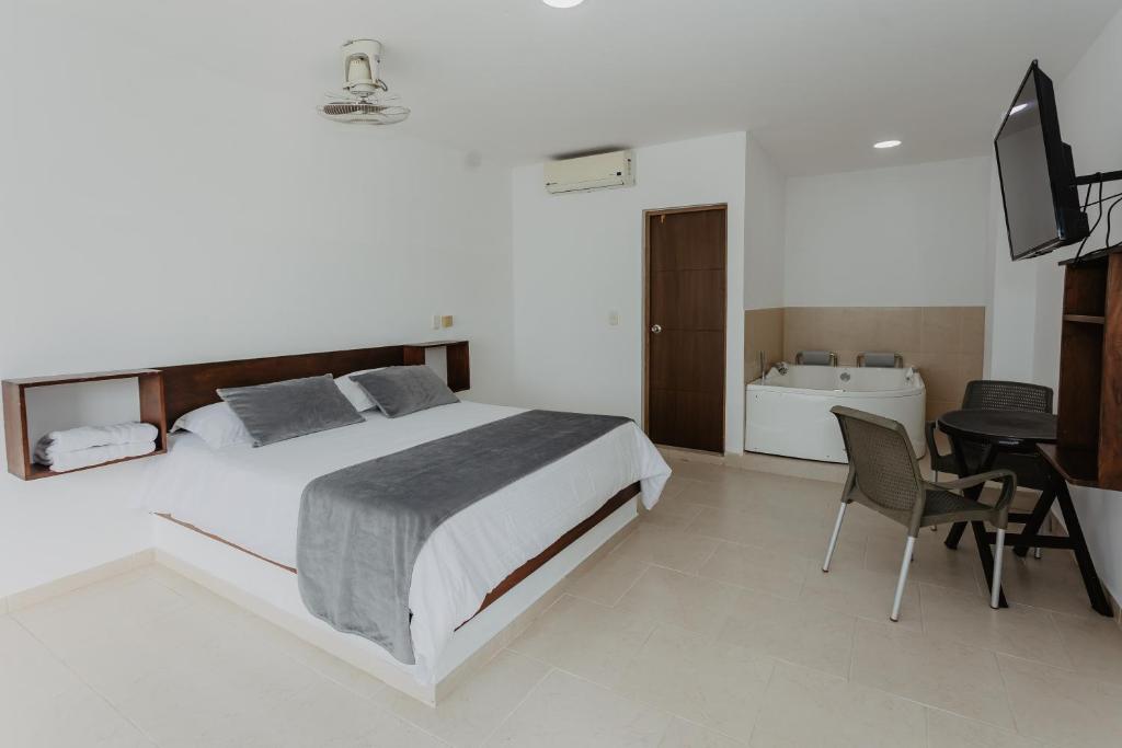 Postel nebo postele na pokoji v ubytování Hotel Plataneras Confort