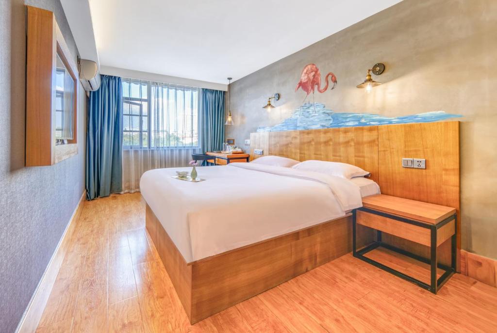 Postel nebo postele na pokoji v ubytování Gongxili - Chujian Hotel