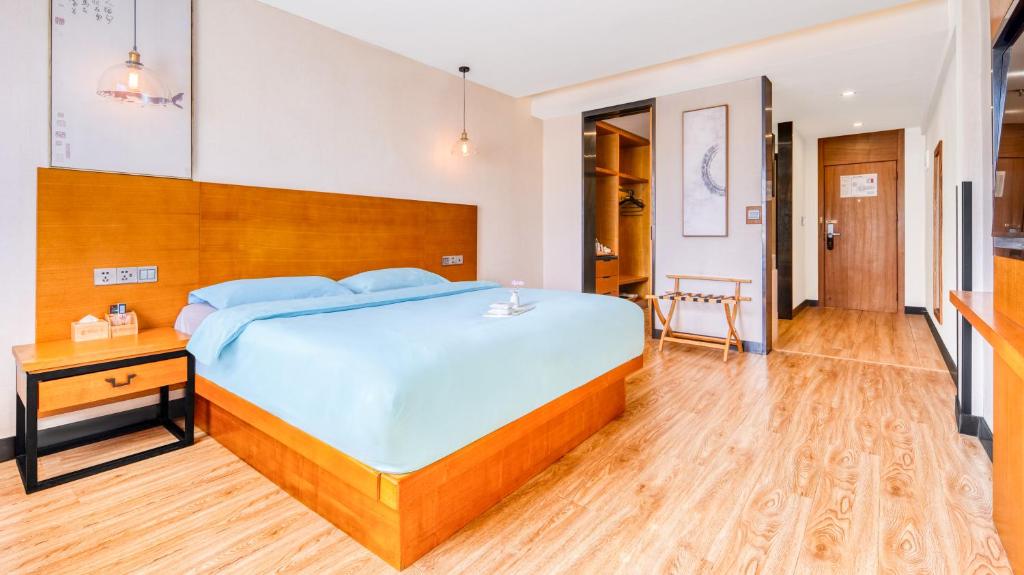 Postel nebo postele na pokoji v ubytování Gongxili - Chujian Hotel