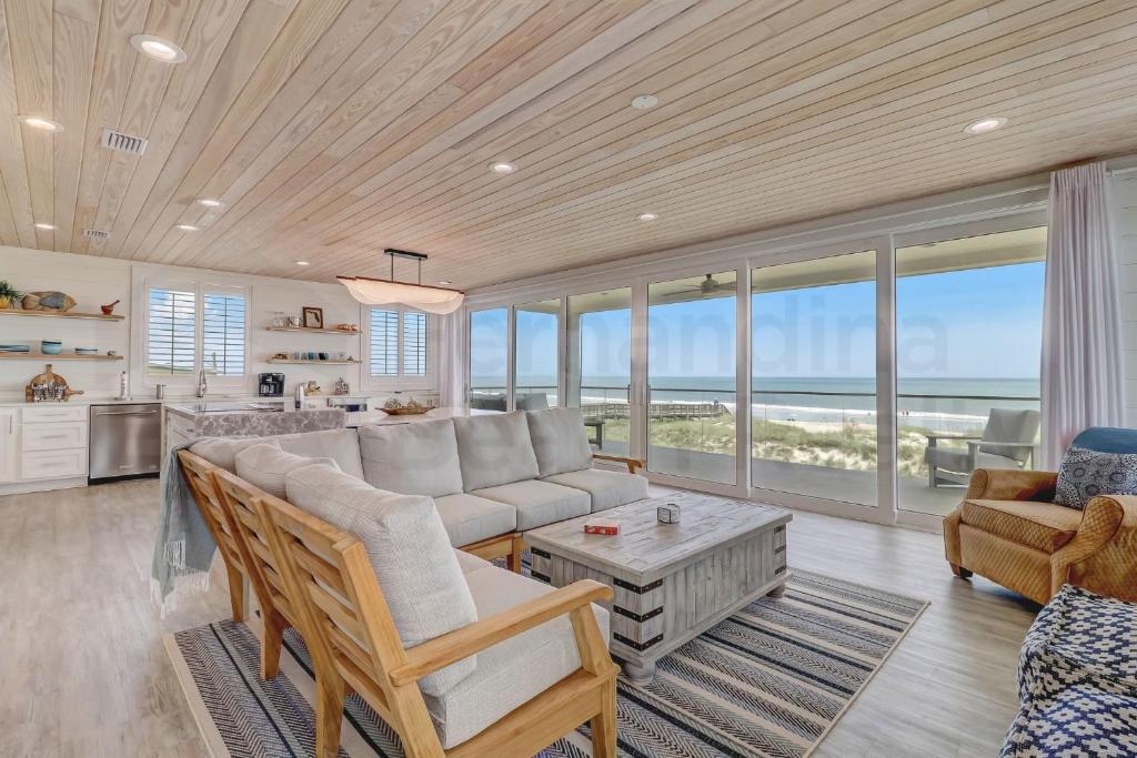 a living room with a couch and a table at 226 SF 2nd Floor townhouse in Fernandina Beach