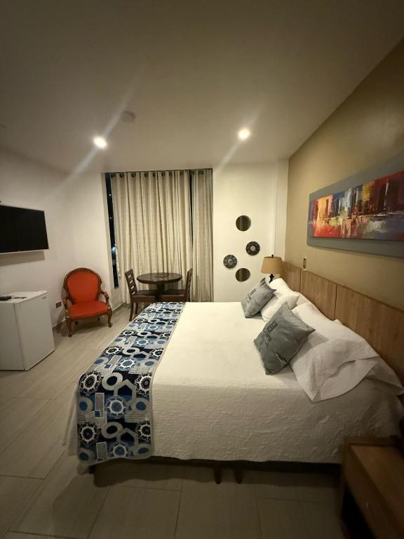 Postel nebo postele na pokoji v ubytování Hotel Ucla Center